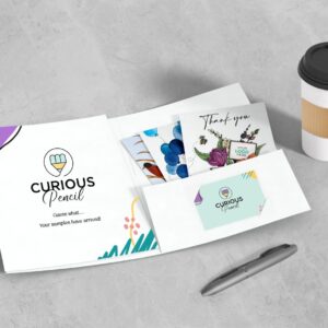 A complimentary Curious Pencil sample pack with four different corporate greeting card designs, customised with company logo and branding.