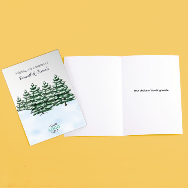 A christmas corporate greeting card featuring snowy trees customisable with your company logo and brand colours.